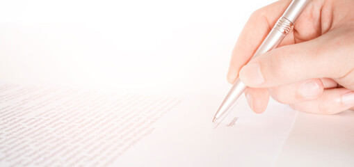 Business worker signing the contract to conclude a deal