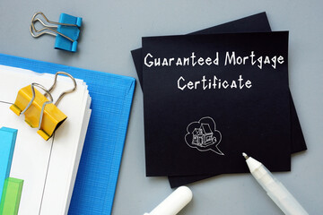 Conceptual photo about Guaranteed Mortgage Certificate with handwritten phrase.