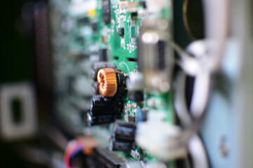 Fototapeta na wymiar Close-up of Blurred background - Printed Circuit Board with electrical components. Concept for electrical engineering and modern technology.