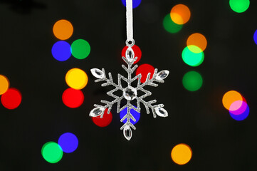 Snowflake decoration against lights