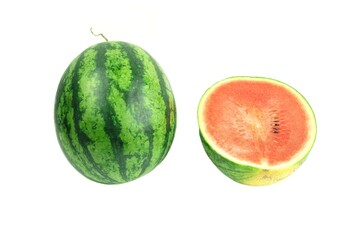 Close up a vertical veiw a watermelon and half cut.