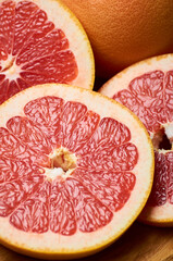 sliced juicy red grapefruit close up, vertically