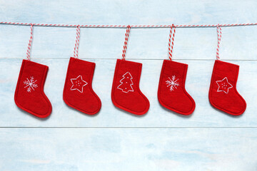 Red Christmas socks on wooden background. Copy space, top view, close up, holiday symbol. Christmas...