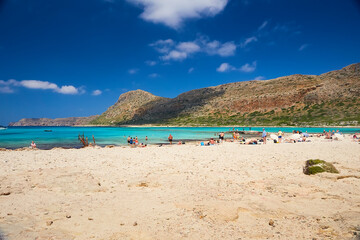 GRAMVOUSA - BALOS, THE CRETE ISLAND, GREECE - JUNE 4, 2019: The beautiful seaview and the people on the beach of Balos.The beautiful seaview and the people on the beach of Balos.