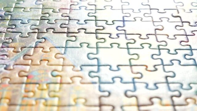 Last Step of Puzzle for Whole Picture. Male Hand Putting the Last Piece of Puzzle to its Place. Full Understanding of Final Product. Assembling Jigsaw Puzzle. Pastime a Hobby. Puzzle Game. Ending Task