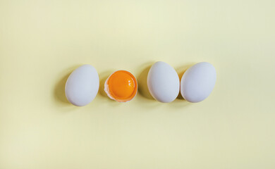 .top view of eggs on yellow background
