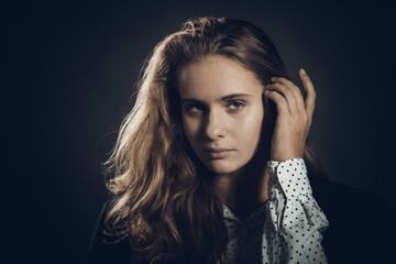 Fototapeta premium Studio portrait of young beautiful longhaired woman