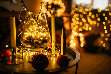 new year cozy home interior with christmas tree and garlands