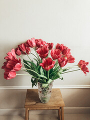 bouquet of tulips on a wooden stand
