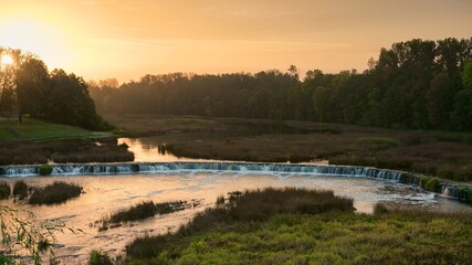 Sunrise over the Venta river in Kuldiga. Panoramic photography.