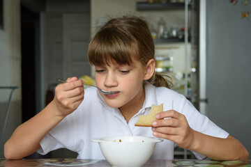 child eating breakfast