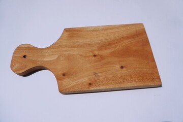 Wooden cutting board isolated on a white background, home industry.