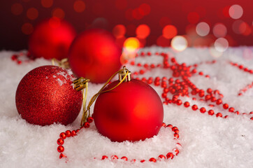 Christmas red balls decorations in the snow
