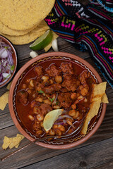 Vegan pozole rojo made with seitan, served in traditional mexican bowl , copy space