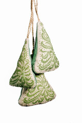 Christmas handmade embroidered decorations soft toys in the form of a Christmas tree isolated on a...