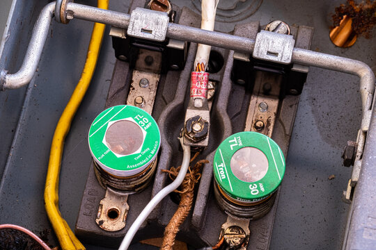 Old electrical fuse box with two fuses