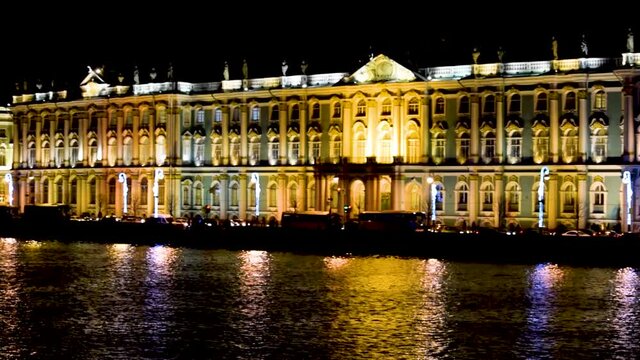 The Hermitage Museum on background at night, St. Petersburg, Russia. Night view of scenic illuminated architecture.