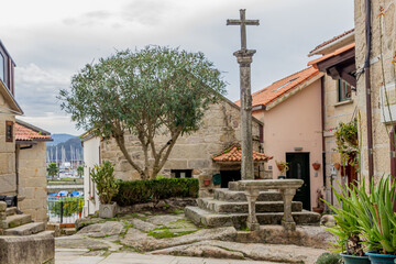 Cruceiro, stone cross, traditional in a square, Combarro, Galicia, Spain
