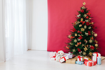 Christmas tree with new year gifts holiday red decorations