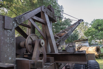 Loading heavy industrial old logging truck machine. Parts of an old logging truck abandoned, select focus.