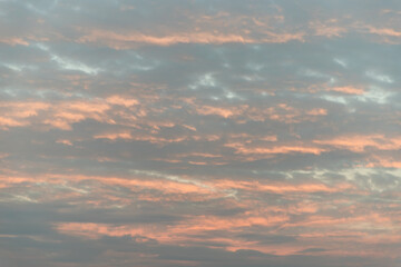 Obraz premium The softness of the clouds and the brightness of the beautiful sky. Light blue clouds and orange on background, Relaxing feeling and inspirational. Copy space, No focus, specifically.