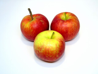 Three nice red and yellow apples.