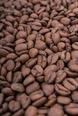 Fresh roasted coffee beans background texture, close up