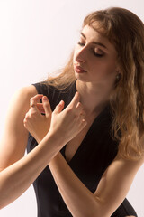 Obraz premium Ballerina in black leotard, dancing against a white background.