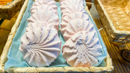 Fresh marshmallow lies on the counter of the pastry shop