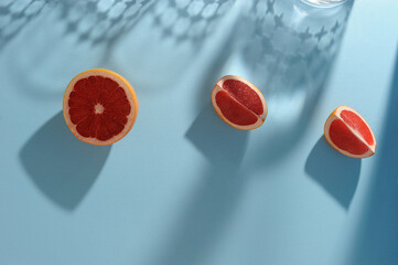 Grapefruits  composed on a bright  blue background.