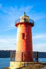 View of red lighthouse over Hudson River on a sunny day