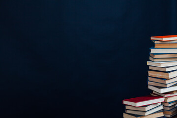 stacks of books for reading and education on a black background in the university library