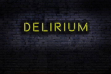 Neon sign. Word delirium against brick wall. Night view - obrazy, fototapety, plakaty