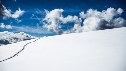 RELAXING SCENERY OF SNOW UNDER A BLUE SKY IN DOLOMITES