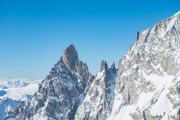 Fototapeta na wymiar Sharpened peaks with snow and glaciers in the Monte Bianco (meaning 
