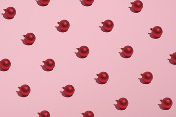 Christmas balls decoration pattern on pink background. Christmas, New Year, winter holidays concept.