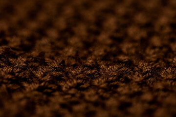 Atmospheric winter background, knitted scarf, warm sweater.