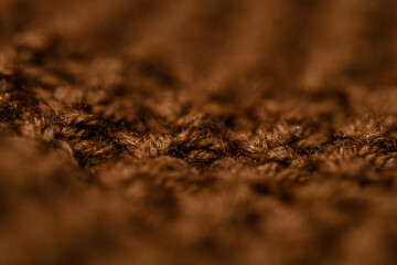 Atmospheric winter background, knitted scarf, warm sweater.