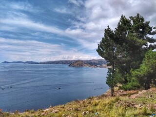 Fototapeta premium Lago Titicaca, Copacabana, Bolivia - Lake Titicaca, Between Peru and Bolivia in the Andes Mountains, is one of South America's largest lakes and the world’s highest navigable body of water. 