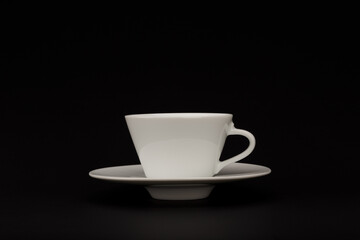 Cup of coffee on black background