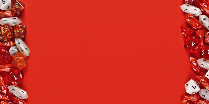 Banner with different roleplaying RPG dice at sides of red background with empty copy space