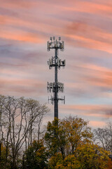 Silhouette signal antenna tower at beautiful sunrise sky background energy 5g satelllite