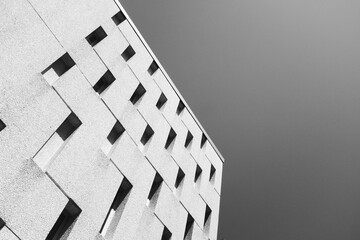 black and white building against sky