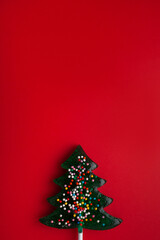 Christmas candy canes on a red background. Confectionery banner. Minimalism. Christmas concept. High quality photo