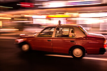 Fototapeta na wymiar fast moving taxi in Kyoto, real motion blur effect