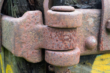 Heavy hinge on an old abandoned ore cart at disused iron mine.