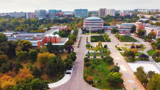 Aerial drone view of university campus among greenery and dwelling houses. Bucharest, Romania