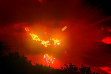 explosion, fiery flash against a red ominous sky, demonic eyes and mouth
