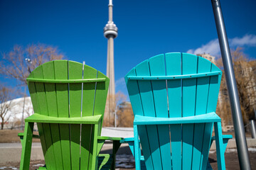 green and blue musk chairs and cn tower