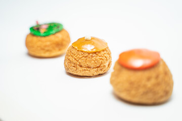 color profitroles isolated on the white background